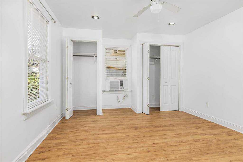 Bright and spacious bedroom with ample closet space. Enjoy the airy feel and natural light in this charming home.