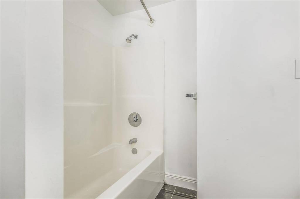 Modern and spacious bath and shower area on the main level of the duplex.