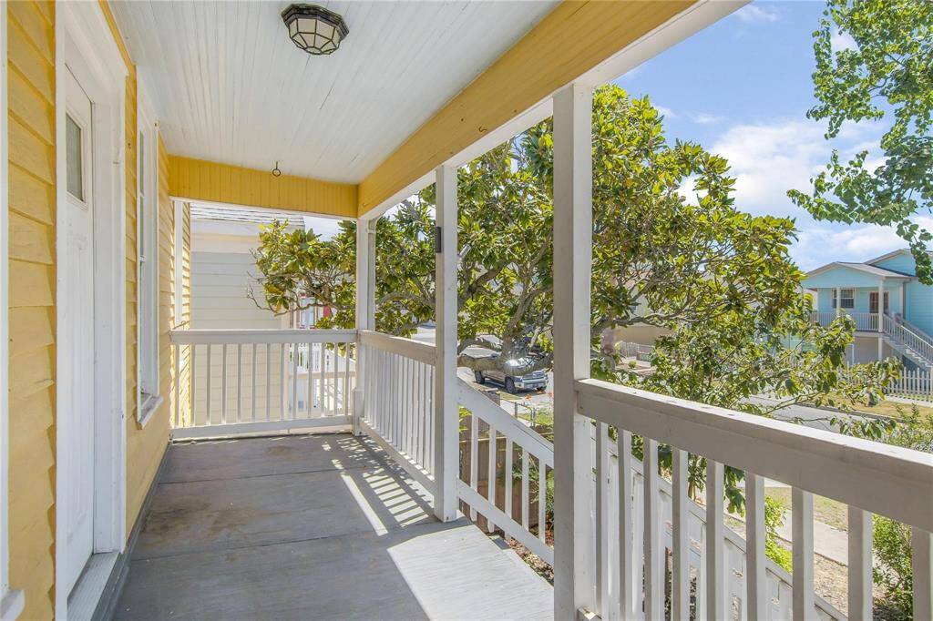 Charming porch on level 2 offering a serene space with a view—perfect for relaxation or enjoying your morning coffee.