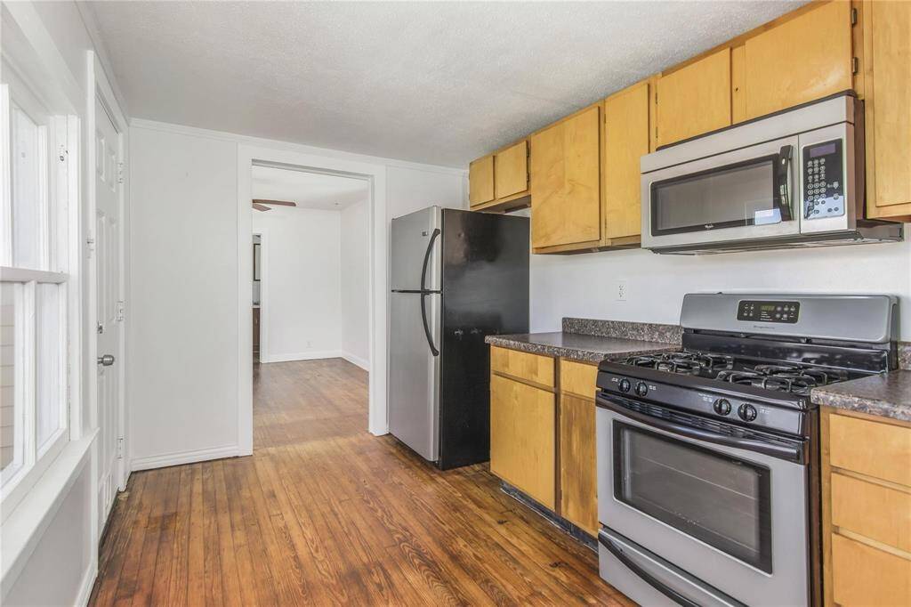 Bright and spacious kitchen on level 2 with modern appliances and ample storage.