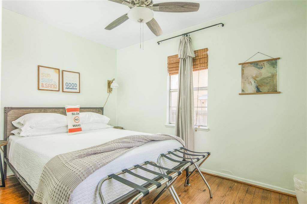 Spacious bedroom in charming cottage, perfect for relaxation.