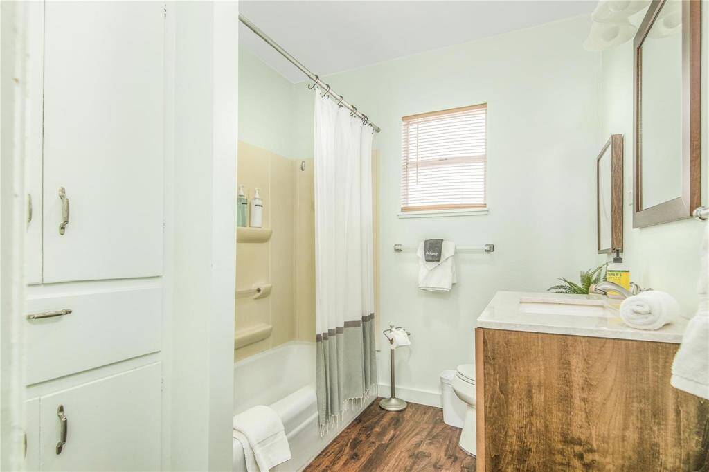 Charming cottage full bath with modern fixtures and cozy ambiance.