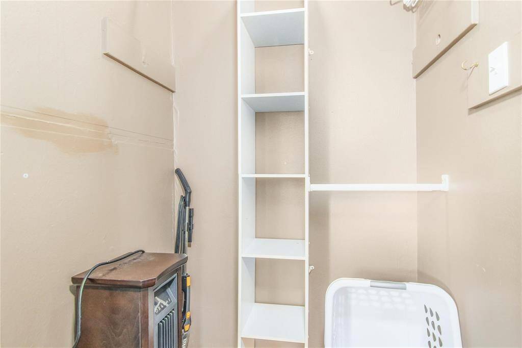 Charming cottage closet with practical shelving and ample storage space.