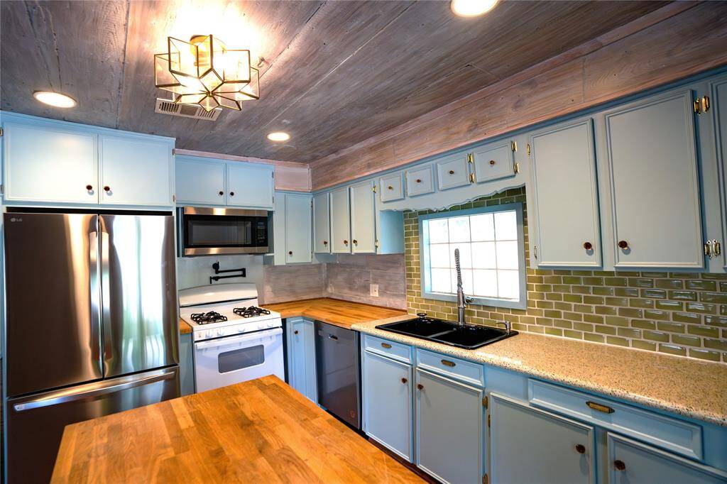 New refrigerator and gas stove.