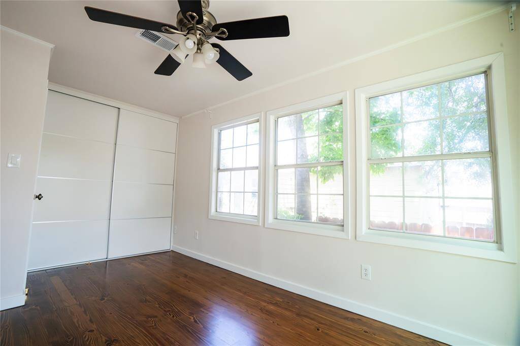 Another view of 2nd bedroom with plenty of windows, wood floor and large closet.