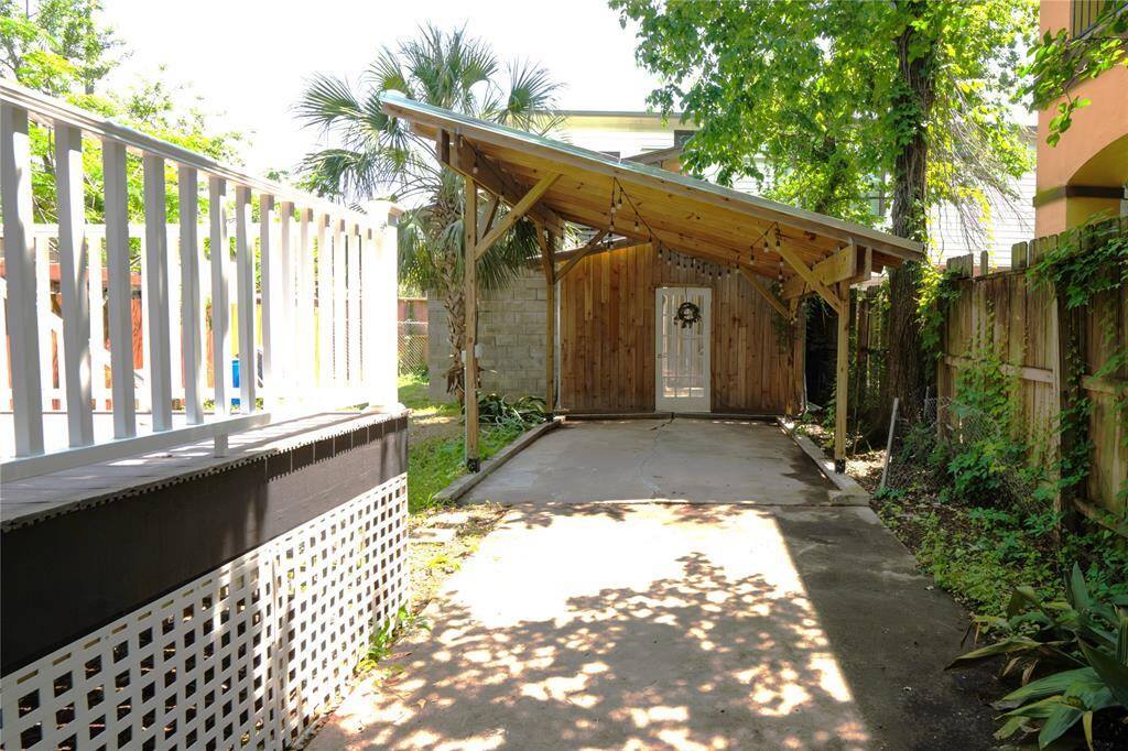 Covered backyard perfect space for dining and entertaining.