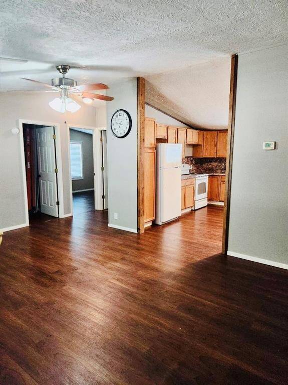 View from front door into kitchen and living room area.
