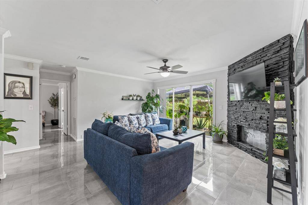 The spacious living area flows effortlessly to the dining and kitchen spaces, creating an ideal setting for entertaining.