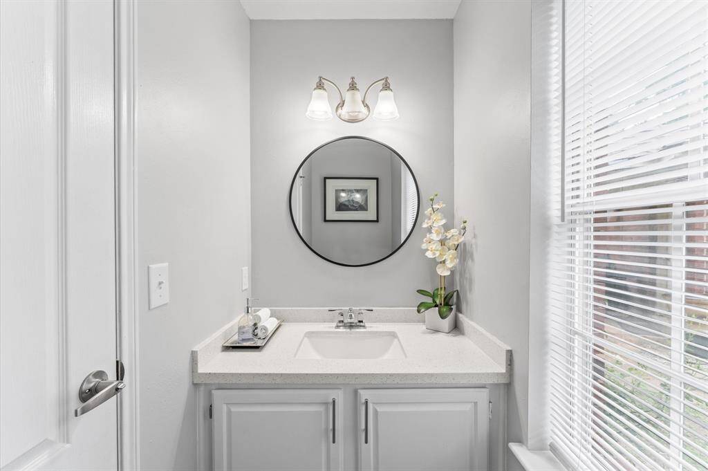 A stylish half bath downstairs adds convenience for entertaining.