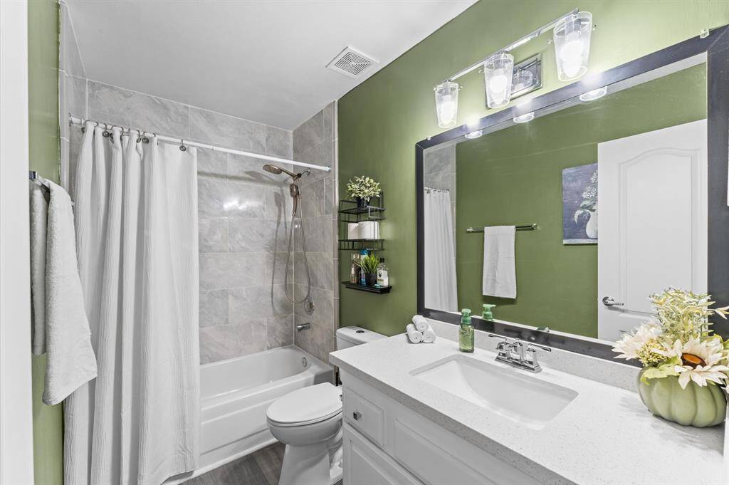 Three additional bedrooms plus an updated full bath provide flexibility for family or work-from-home needs