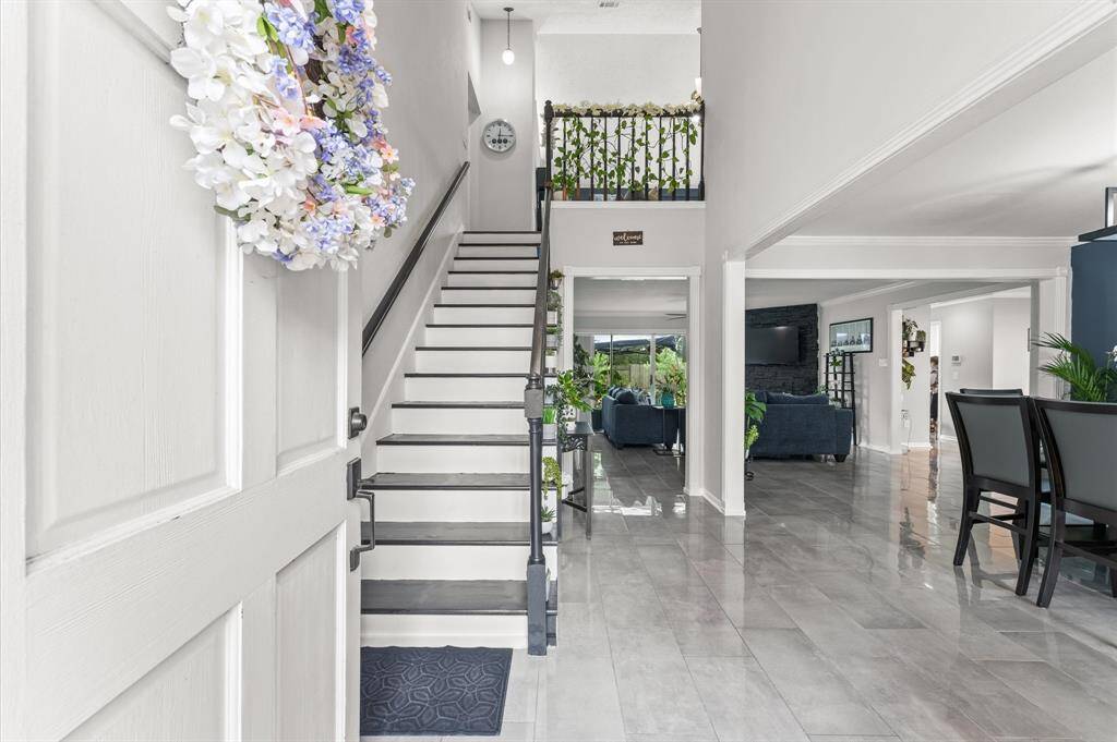 Inside, you’ll find a bright, open floor plan with designer touches at every turn, luxury flooring, custom cabinetry, upgraded lighting, and a completely reimagined kitchen with quartz countertops and stainless steel appliances.