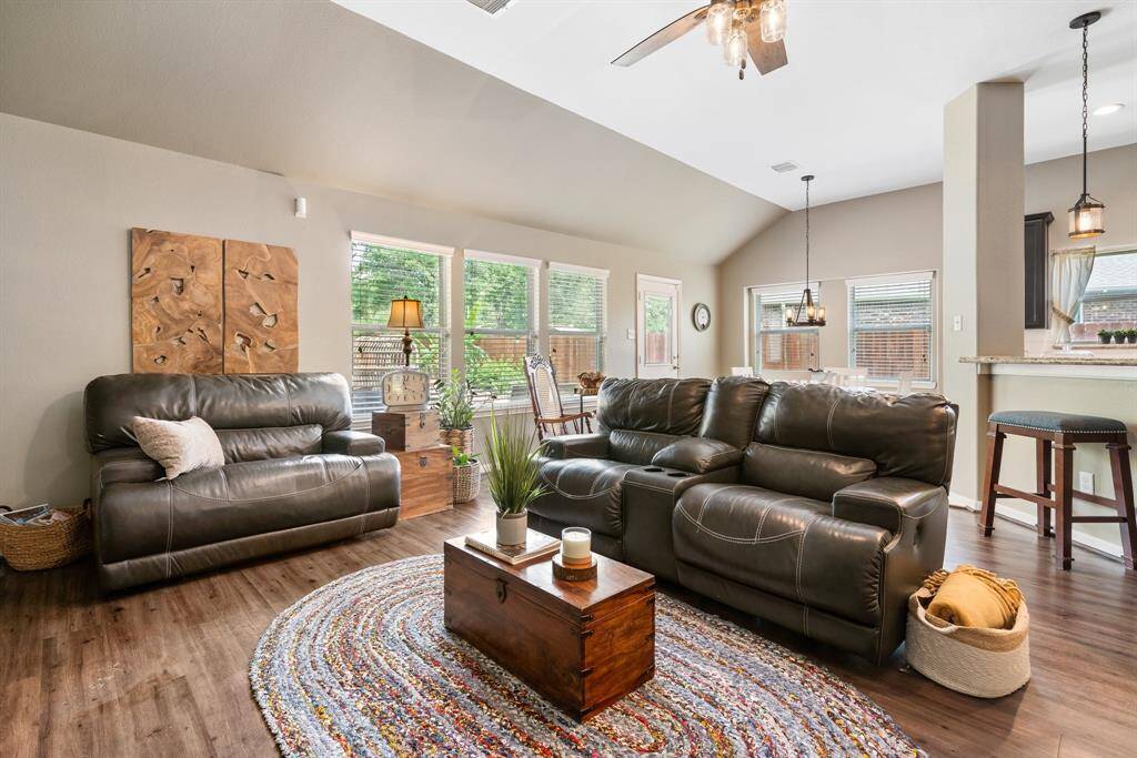 Plenty of windows allow plenty of light into the family room and kitchen