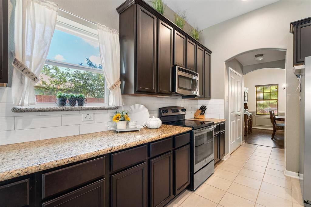 The wide pantry is directly across the hall from the laundry room