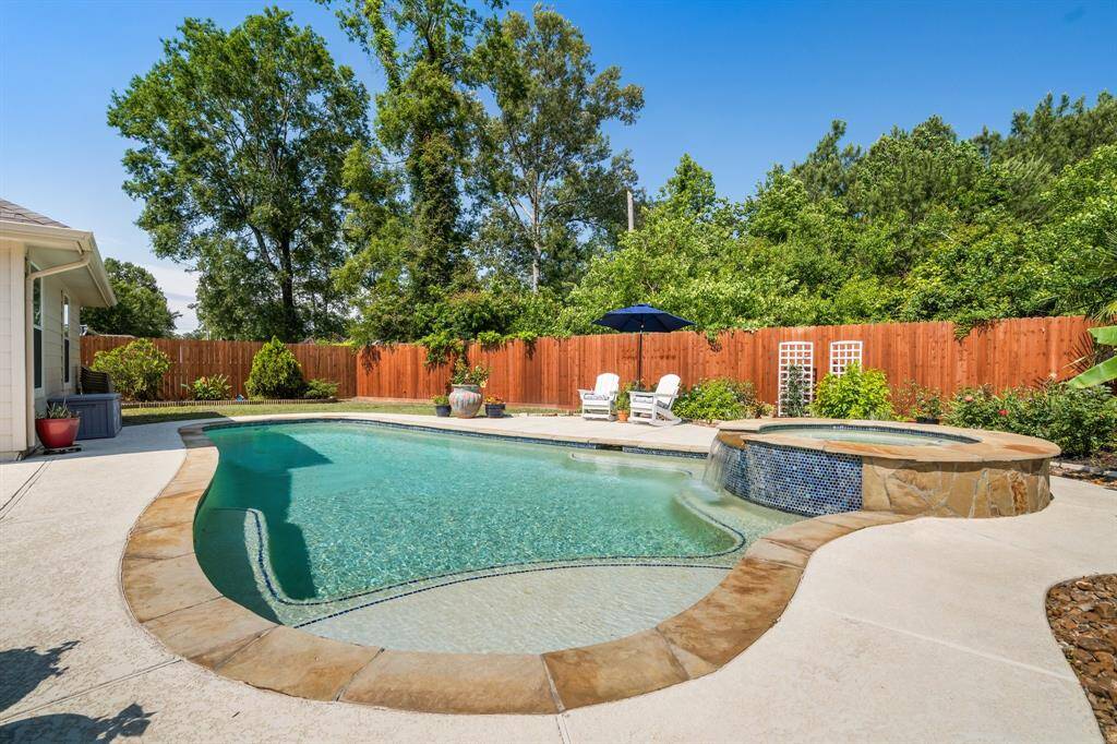 Notice the beautiful landscaping around the pool area