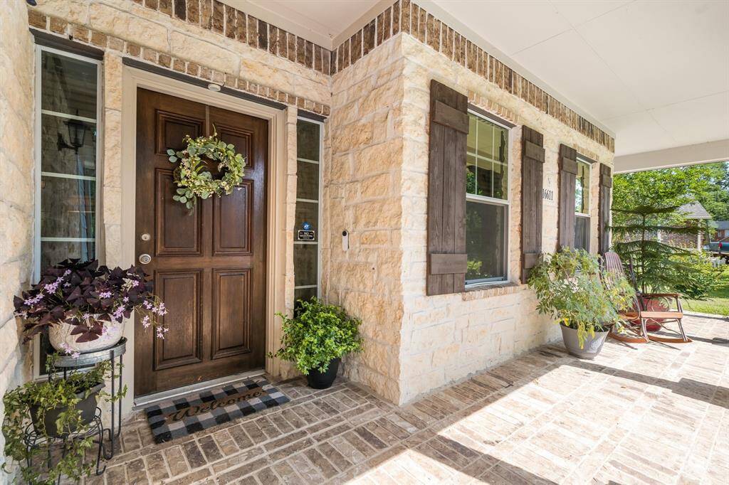 Beautiful porch with brick flooring and deep enough for rocking chairs