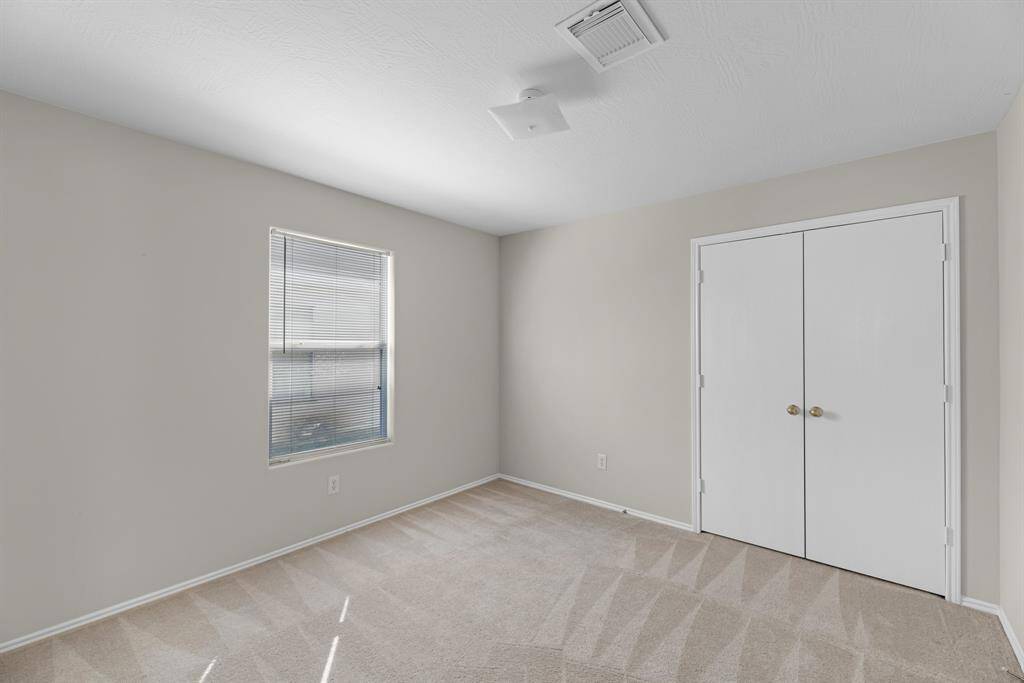 Secondary bedroom has a double closet