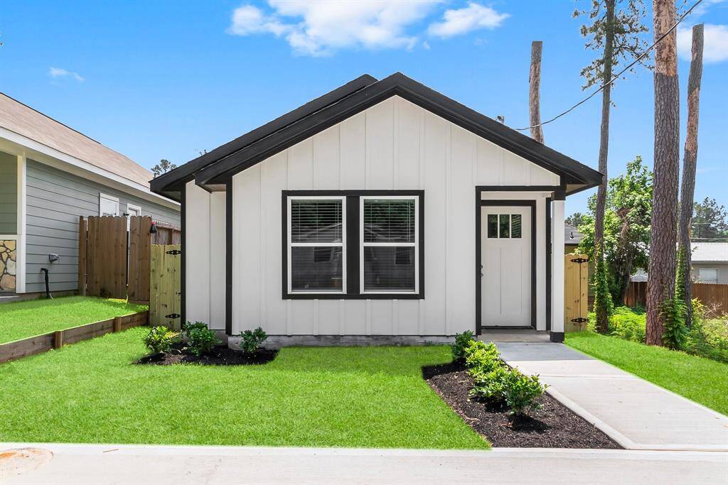 Modern single-story home with pristine curb appeal, fresh landscaping, and a welcoming entrance—perfect for cozy living.