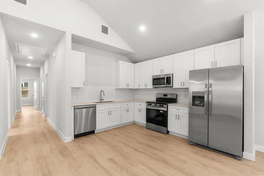 Modern single-story home with pristine curb appeal, fresh landscaping, and a welcoming entrance—perfect for cozy living.
