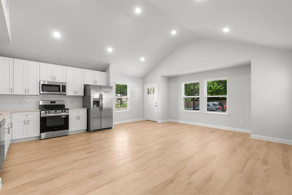 Modern single-story home with pristine curb appeal, fresh landscaping, and a welcoming entrance—perfect for cozy living.