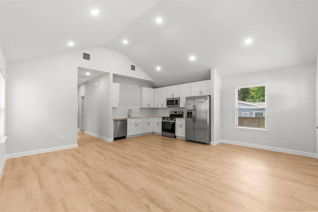 Modern single-story home with pristine curb appeal, fresh landscaping, and a welcoming entrance—perfect for cozy living.