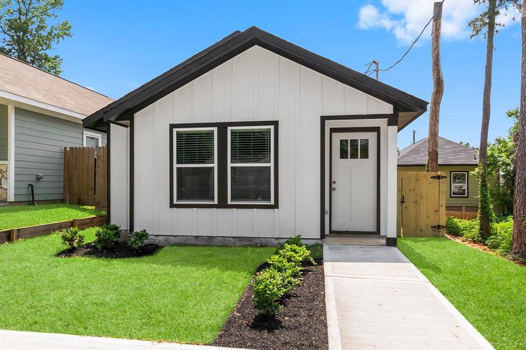 Discover this charming single-story home boasting a sleek, modern design. Enjoy a pristine lawn, inviting paved walkway, and a cozy front porch—ideal for those seeking easy maintenance.