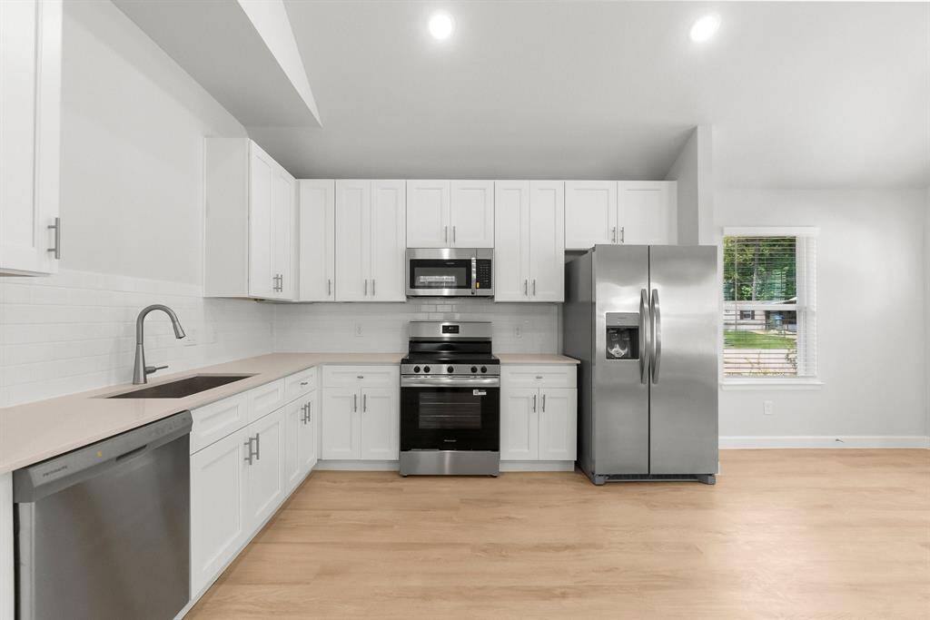 Modern single-story home with pristine curb appeal, fresh landscaping, and a welcoming entrance—perfect for cozy living.