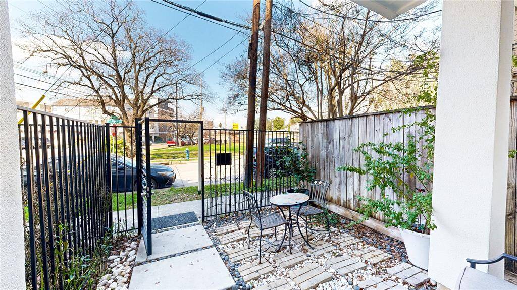 Another view of the front entry, gated patio space.