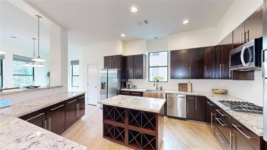 Counter space for days. Lovely granite countertops, plenty of cabinets to hold all of your cooking needs, and the most wonderful thing - drawers! Nice storage for your favorite Wines and Champagne.