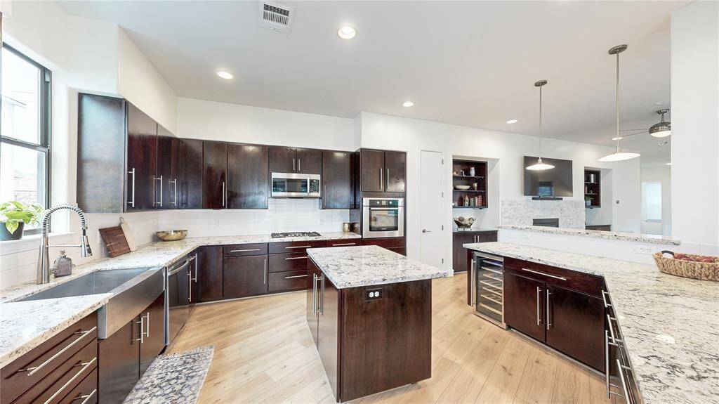 Another view of this Chef's Dream Kitchen. While Chiller, 5- burner gas cooktop, and a Bosch Oven are just some of wonderful perks this kitchen offers.
