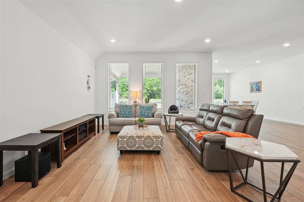 The spacious living room offers a cozy yet open space to relax and entertain. From the living room, you can enjoy beautiful views of the lush forest, creating a peaceful and serene atmosphere.