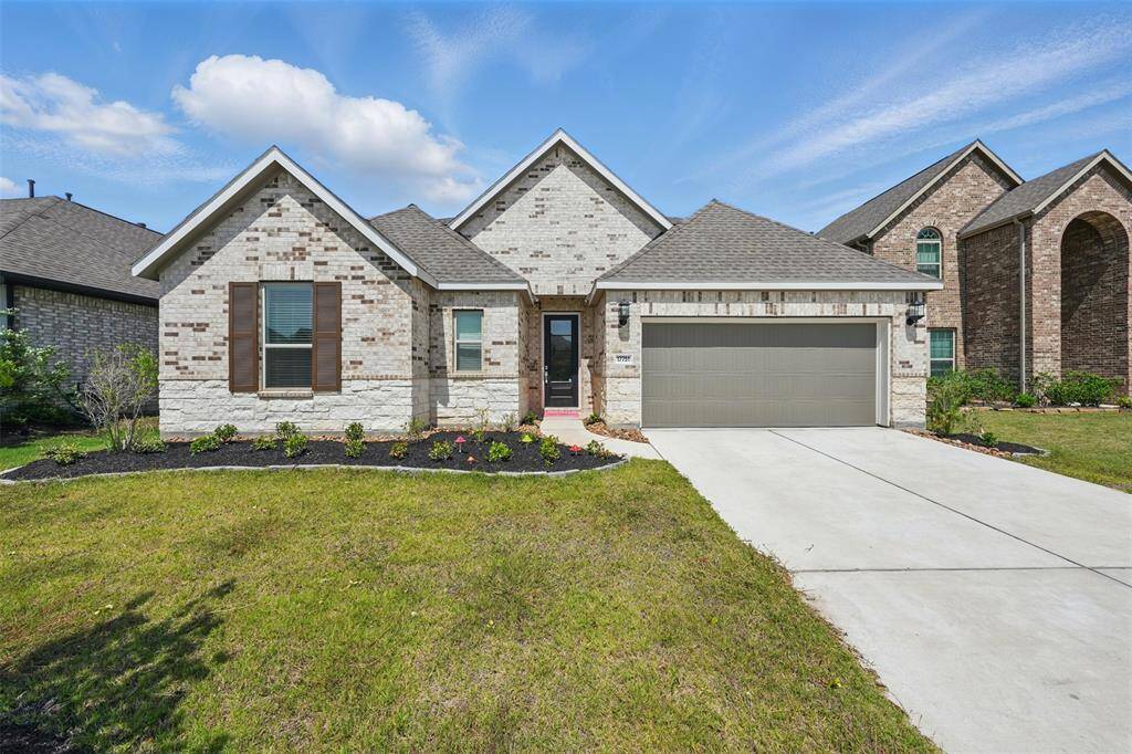 Charming brick exterior and a welcoming front view give this home timeless curb appeal and lasting durability.