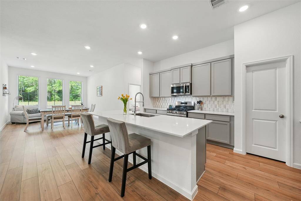 A walk-in pantry tucked between the cabinets for extra storage.