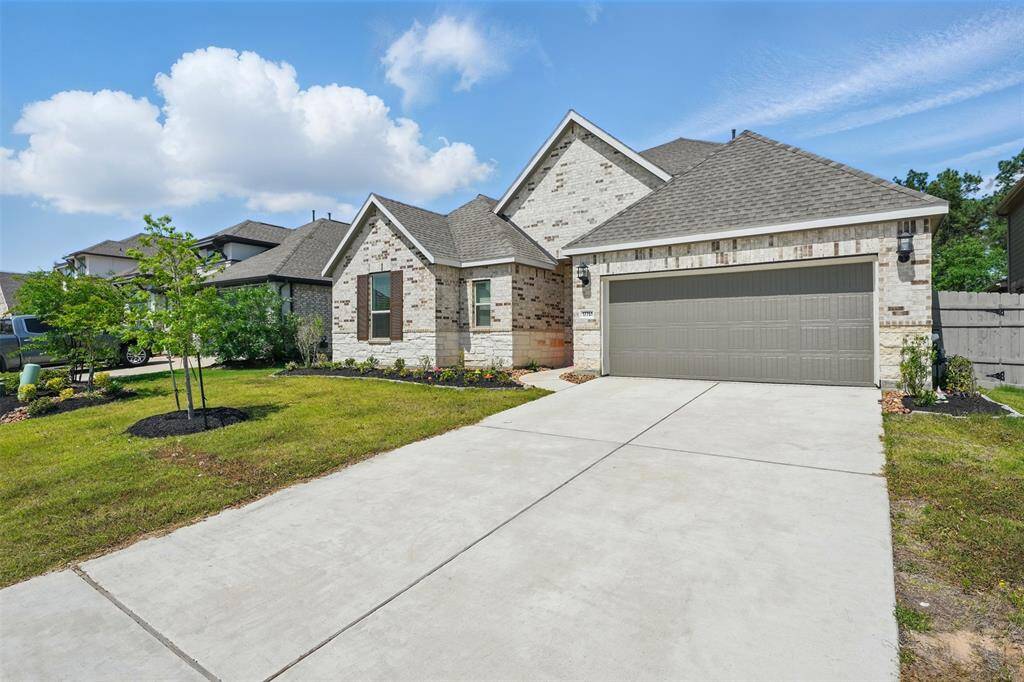 Spacious front driveway offers plenty of parking and adds convenience for family and guests.