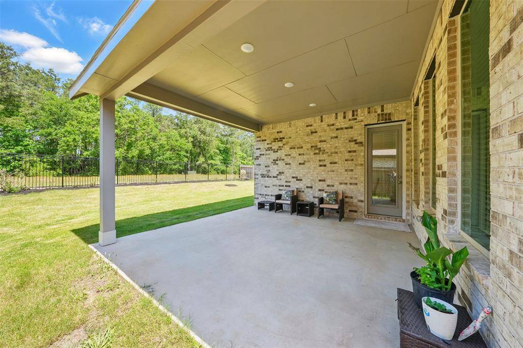 Step outside to the covered backyard patio, where you can relax or entertain while enjoying peaceful views of the forest and the privacy of having no back neighbors.