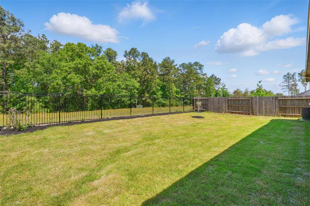 Step outside to the covered backyard patio, where you can relax or entertain while enjoying peaceful views of the forest and the privacy of having no back neighbors.