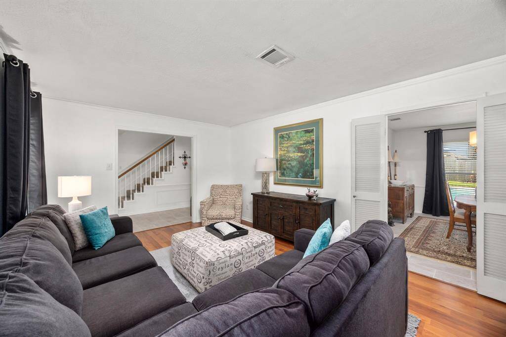 Good-sized living room flows into dining room and features louvered doors.