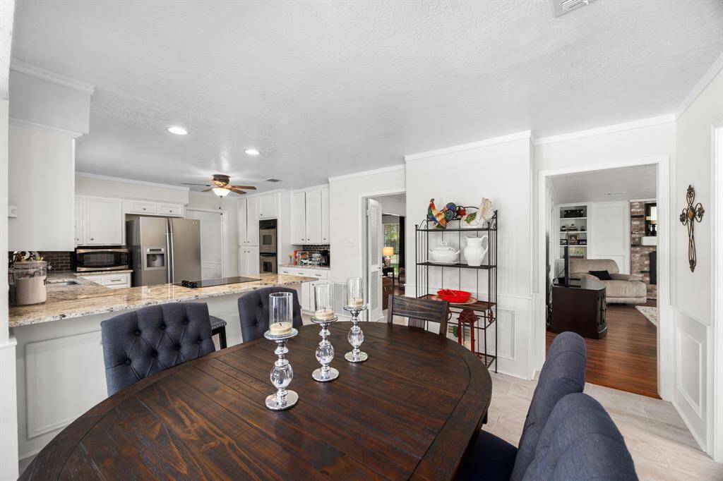 View from breakfast area to family room and kitchen