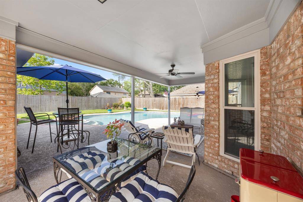 Outdoor living area overlooking pool