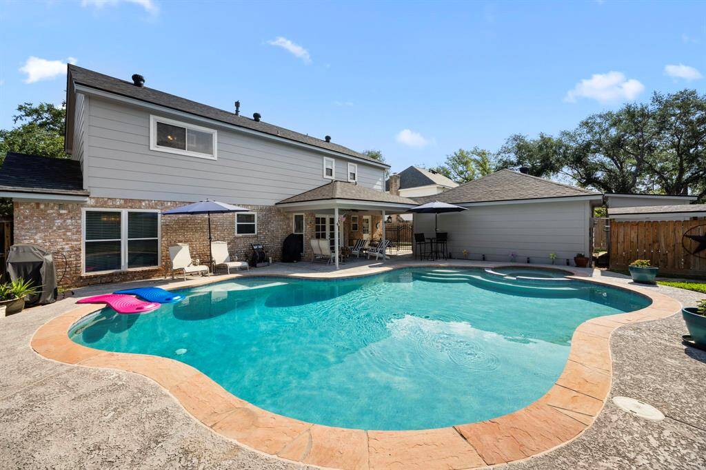 View of pool and back of house