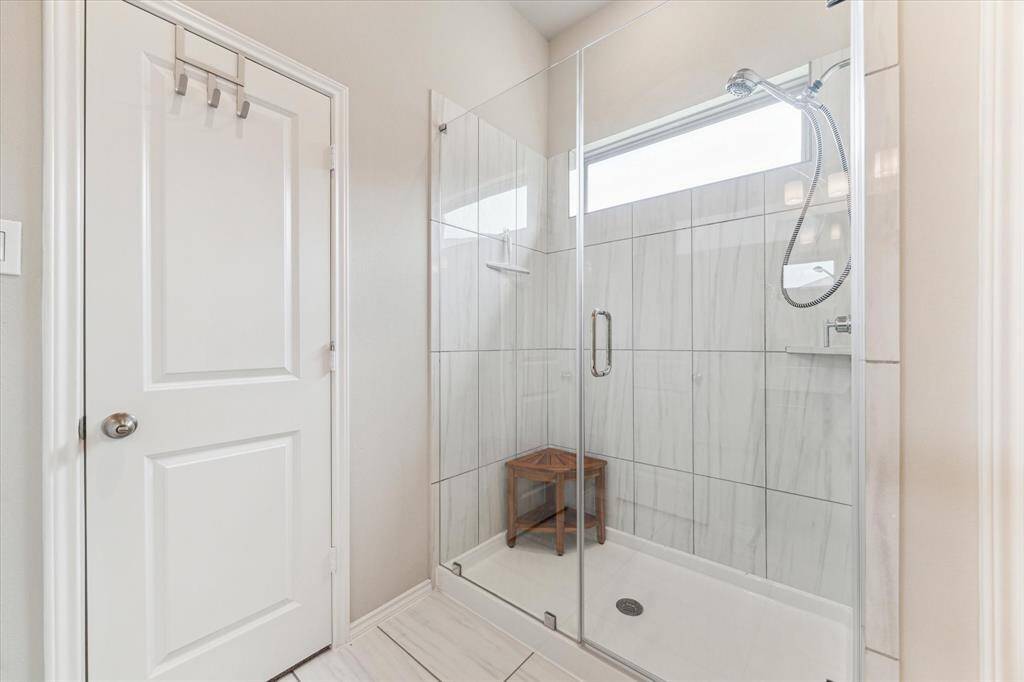 Whether racing to beat the morning traffic or winding down after a long day, you’ll love the spacious walk-in shower with frameless glass, beautiful tilework, and upgraded fixtures. It’s a daily dose of luxury you’ll never want to live without