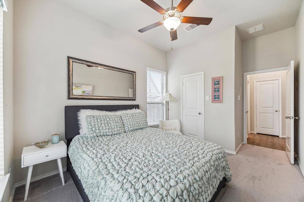 Both guest bedrooms offer plenty of space to stretch out and relax, with neutral tones and large closets that create comfortable retreats for family or visitors. Each room provides easy access to a full bathroom, making busy mornings and overnight stays a breeze.