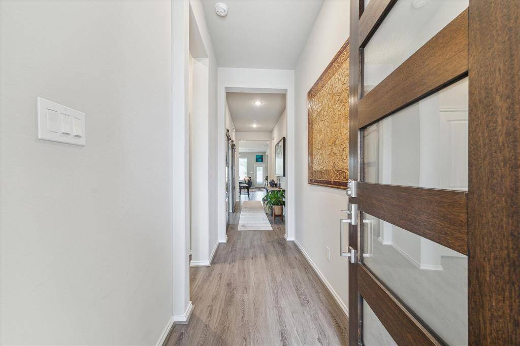 It will be love at first sight. Step through the modern five-light door to discover a home filled with elegant finishes, thoughtful upgrades, and a layout designed to fit the rhythm of your life.