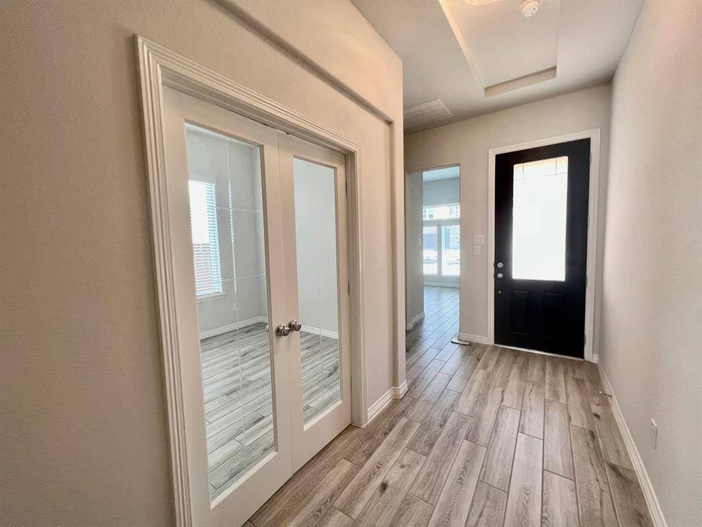 Entry to a study room with glass French doors