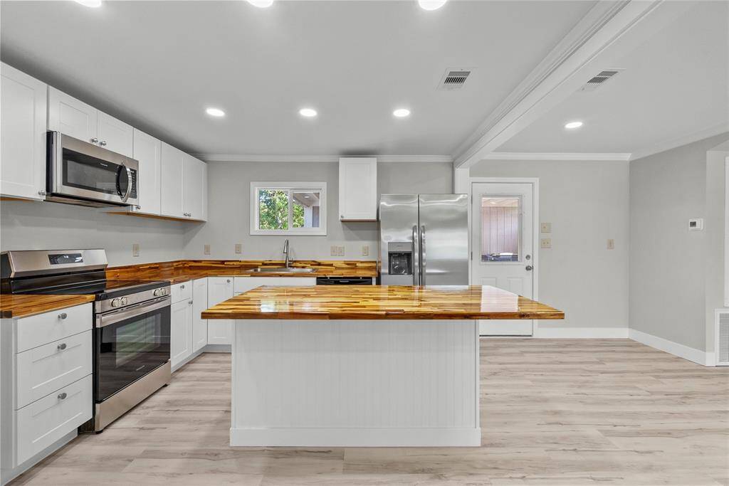 Open concept Kitchen with Butcher Block Countertops