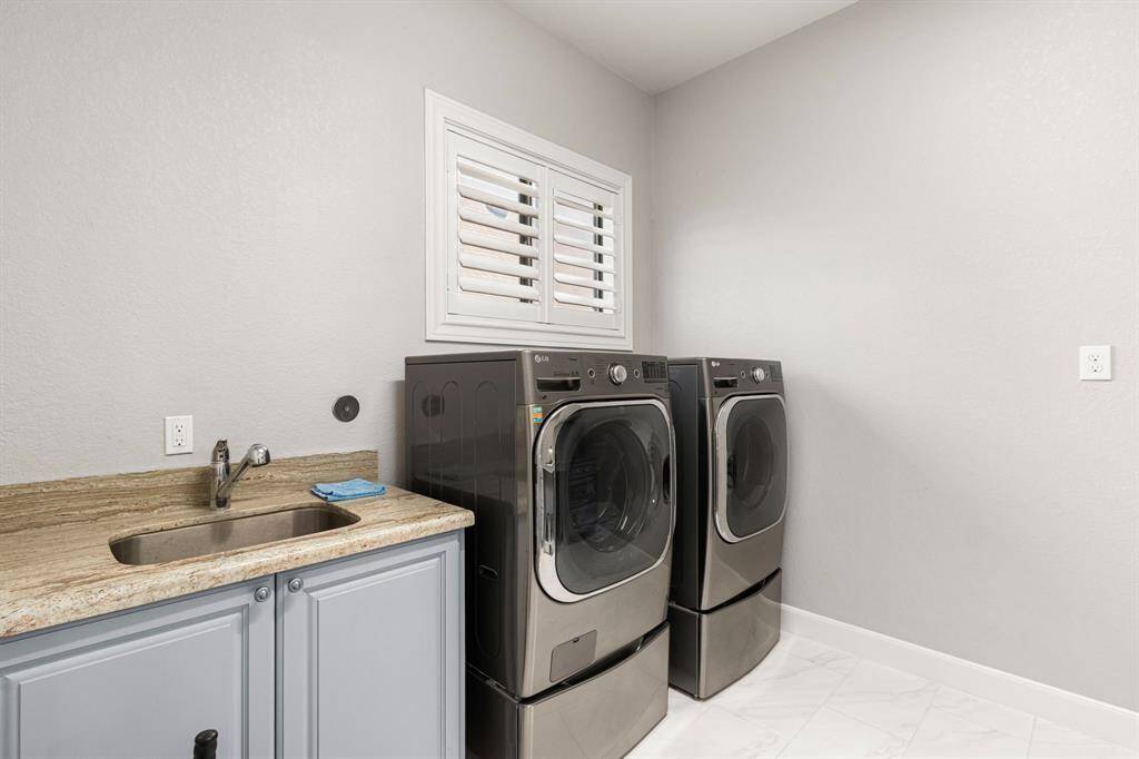 Spacious laundry room with sink