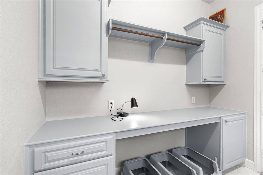 Shelving + hanging space in laundry room
