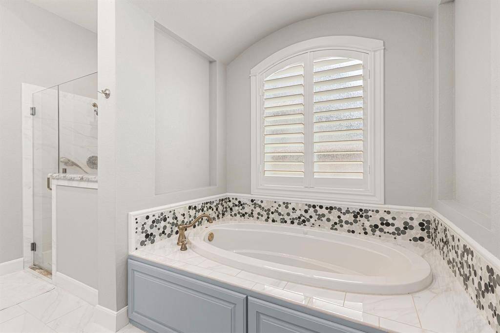 Large soaking tub and separate primary shower