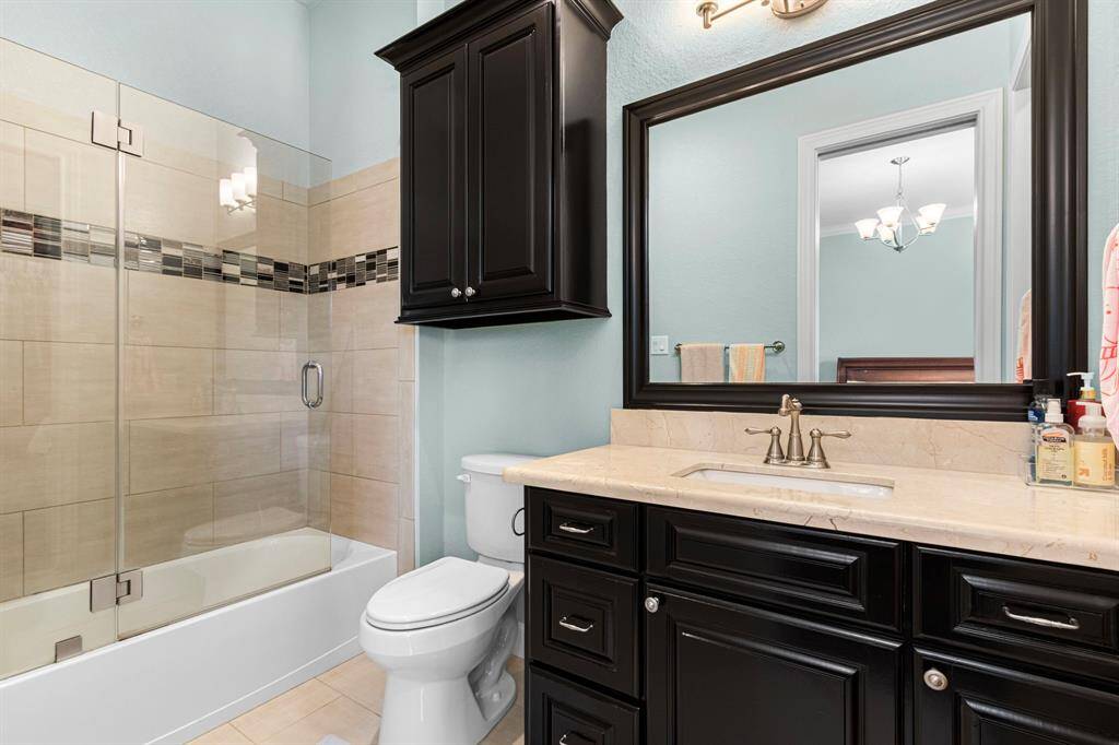 Private bathroom w/ sliding glass shower doors