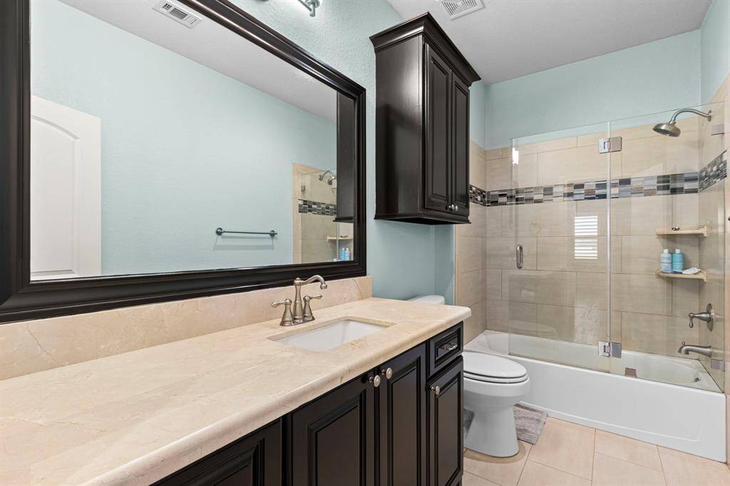 Upstairs bathroom with upgraded sliding glass shower doors