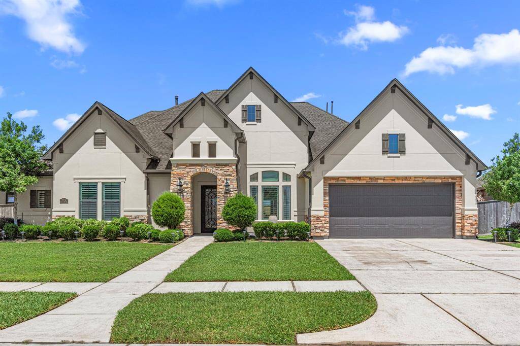 Double-wide driveway + 3 car garage